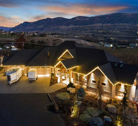 holiday lighting installed on house roof